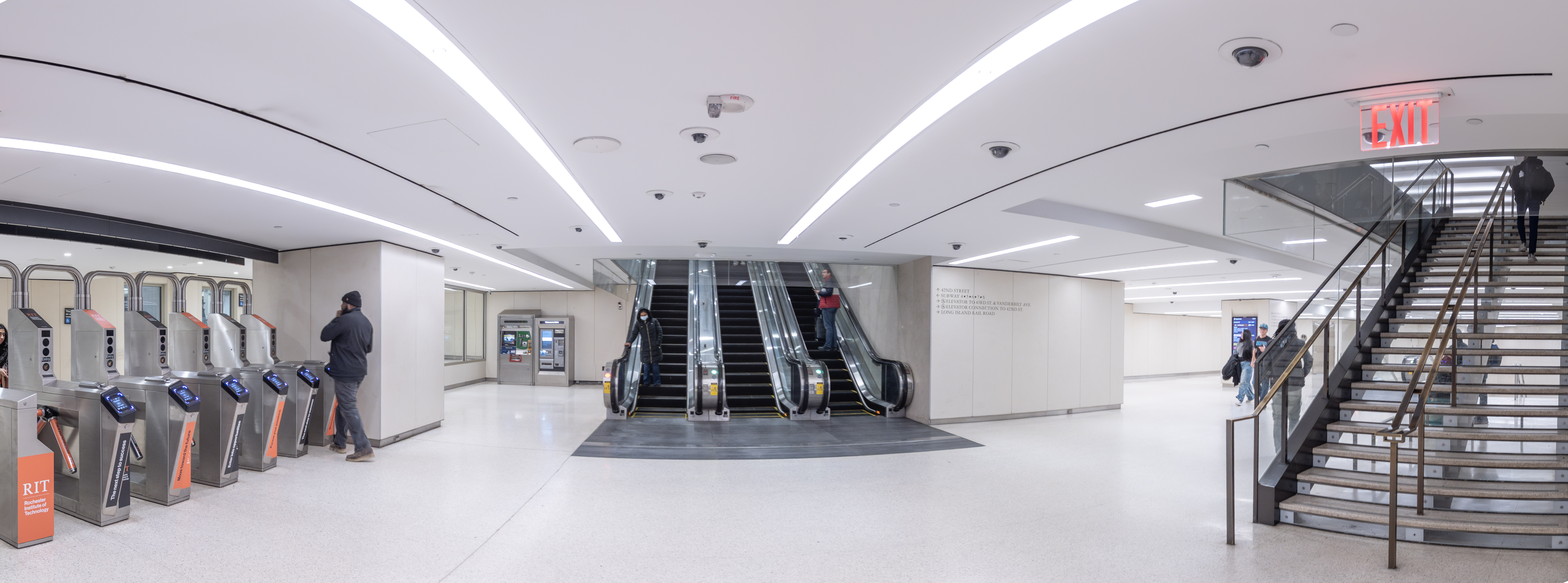 Escalators and turnstiles in subway station